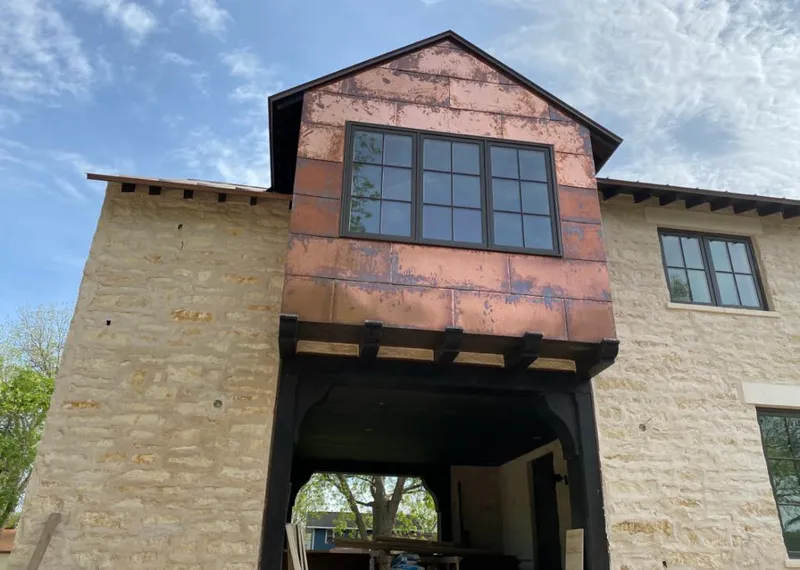 Copper metal panel facade on a stone building for Metal Roof Coating in Rancho Santa Margarita