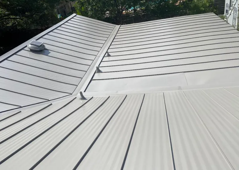 Solar attic fan installed on a metal roof for Roof Ventilation in Rancho Santa Margarita